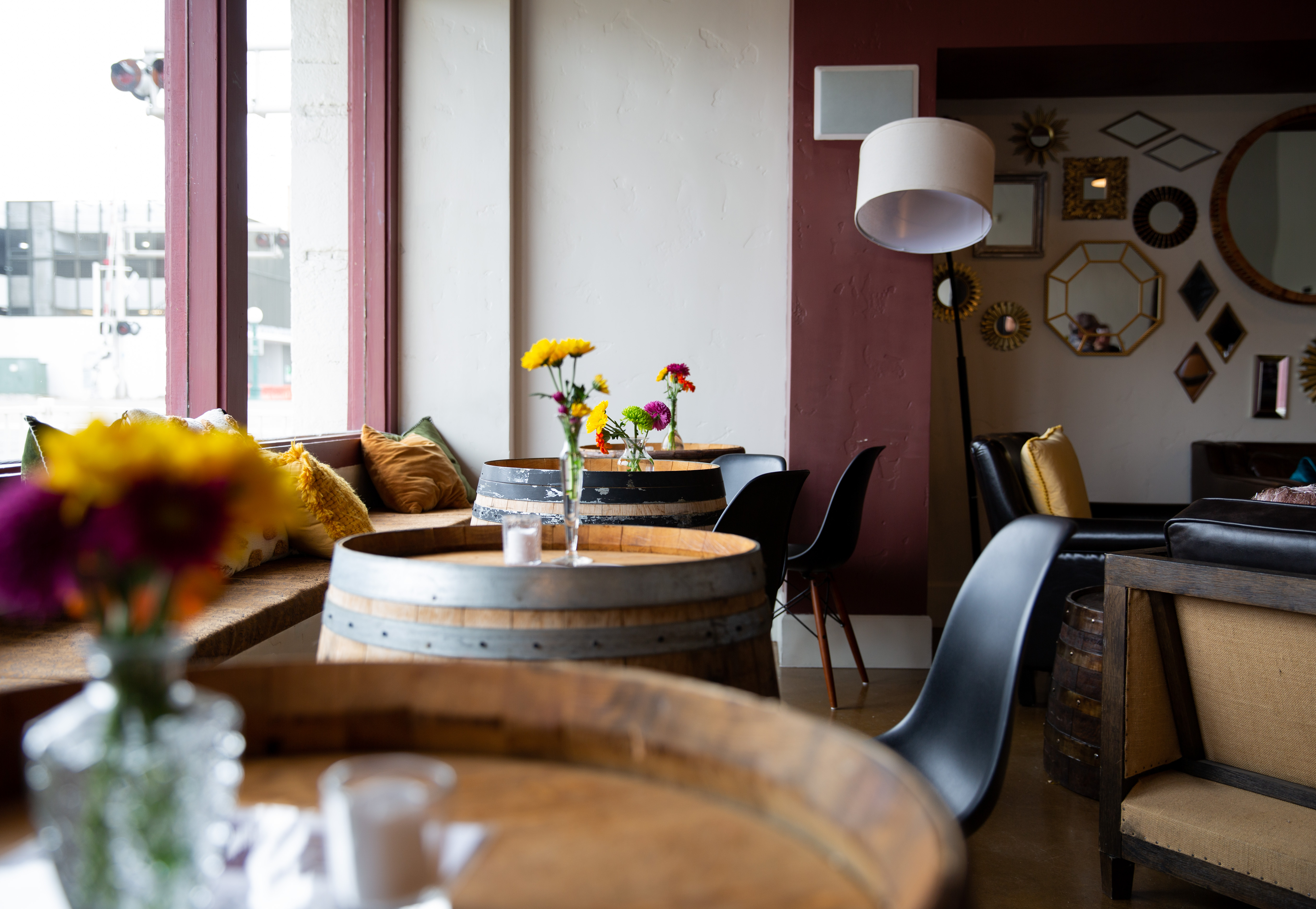 The Lounge interior with barrel tables